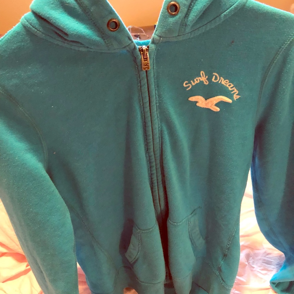 Dark teal hollister zipper sweatshirt with hood.